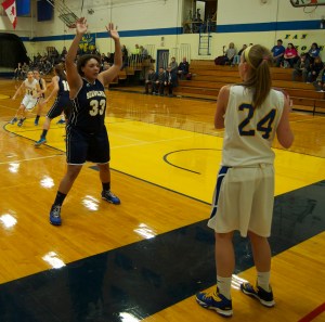 Amira Jones applies pressure on an inbound pass against UMPI's Rebecca Campbell. Amira finished with 13 points while grabbing 10 rebounds in the Lady Wolves win at Presque Isle.