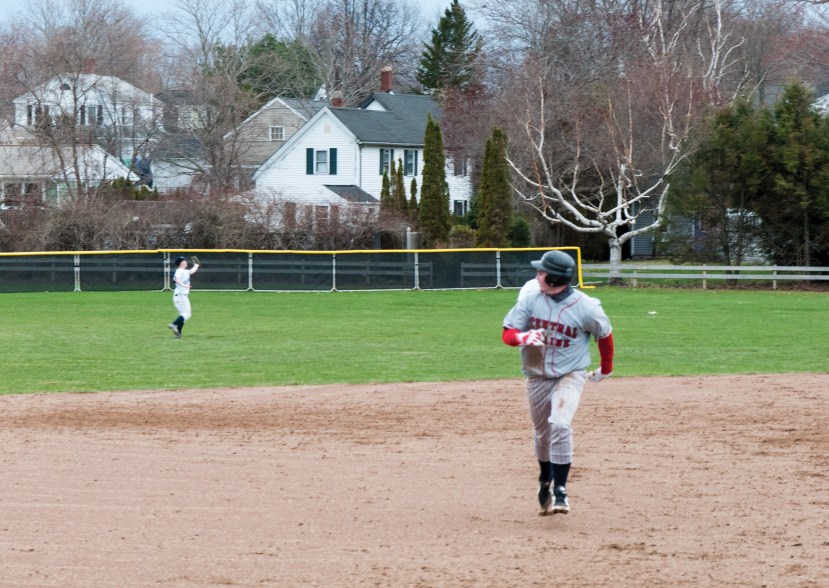 Shaun Adams grabs a fly to center field as unidentified Mustang looks to advance. SMCC is batting .300 while their on base percentage is .396.