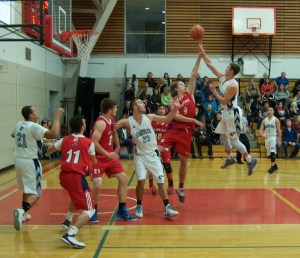 Joradn DeRosby gains air to get a shot off against an awnry UNB-St John’s defense in Sunday’s action.
