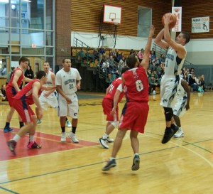 SMCC guard John Ambile gets mid-range a jumper off in Sunday’a\s action. John finished the day with 25 points.